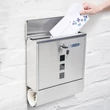 Natúr felületű anyagában rozsdamentes acél kültéri fali postaláda nyitható fedlappal éppen egy benne elhelyezendő levéllel