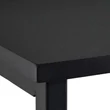 Medo laptop tartó állvány fekete színű MDF asztallapjának egyik sarka közelről