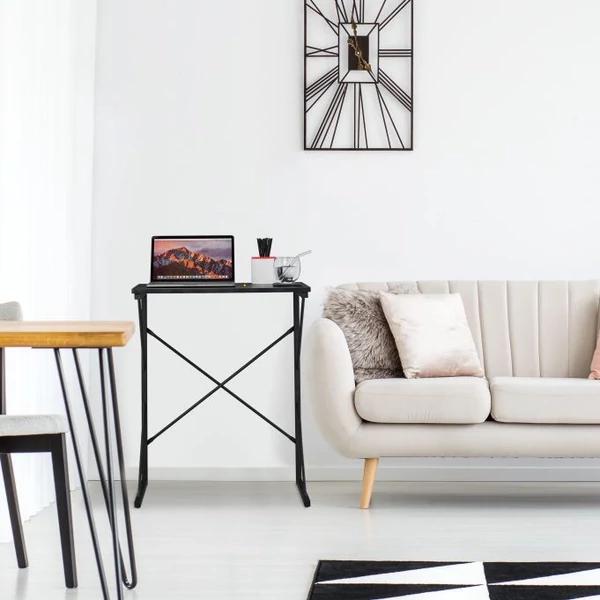 Fekete színű fix magasságú acélvázas laptop tartó és munkaállomás a kanapé mellett