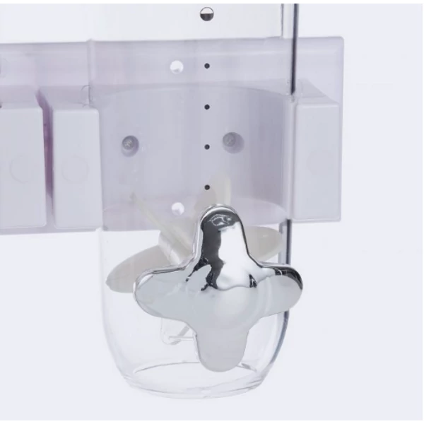 Adagolókerék egy müzlitartó és gabonapehely tároló alsó részén